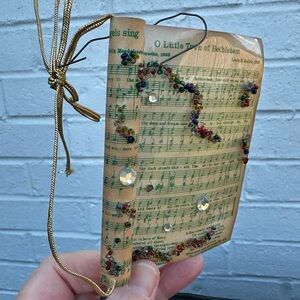 Vintage Sheet Music Ornament Wrapped in Plastic decorated with Beads and Jewels
